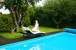 Petite Russian Marfa swims naked in the pool